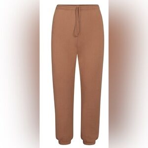 EUC SKIMS Outdoor Fleece Jogger Tigers Eye size Large L